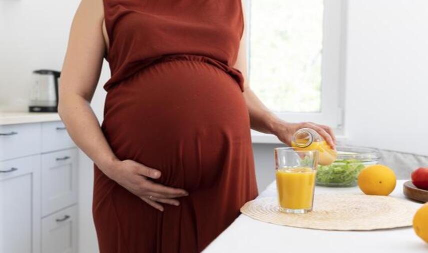 close-up-pregnant-woman-pouring-juice (1) (1) close-up-pregnant-woman-pouring-juice (1) (1)